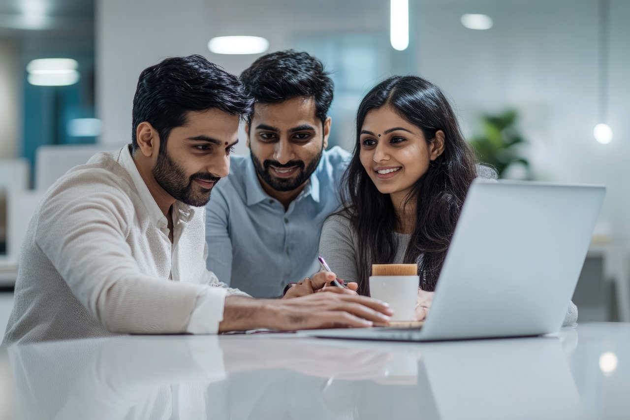 Professional team collaborating on technology projects in a modern workspace